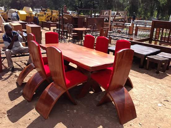 King size dinning, 8 seater made of pure mahogany timbers, brown in color.