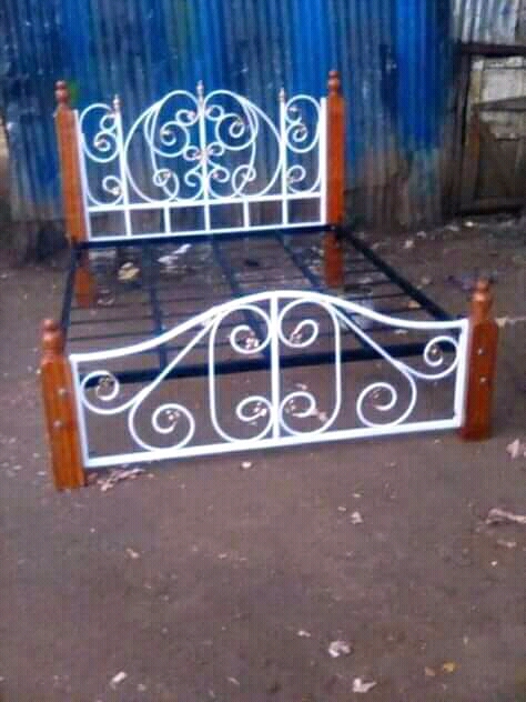 Metallic bed, 4×6. Painted white.