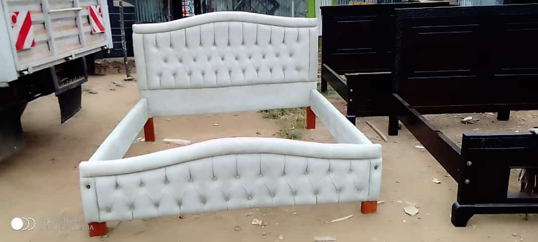 Fabric queen bed with hydensity foam and high quality white fabric.