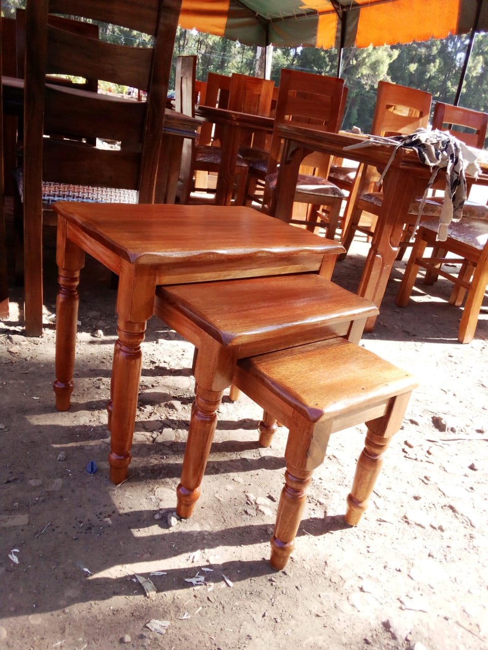 Nest of stools, 3pcs mahogany, brown in color.