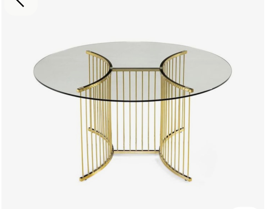 Metallic table frame with a glass top.