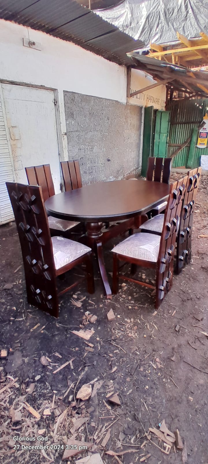 Chocolate oval dinning  6 seater.